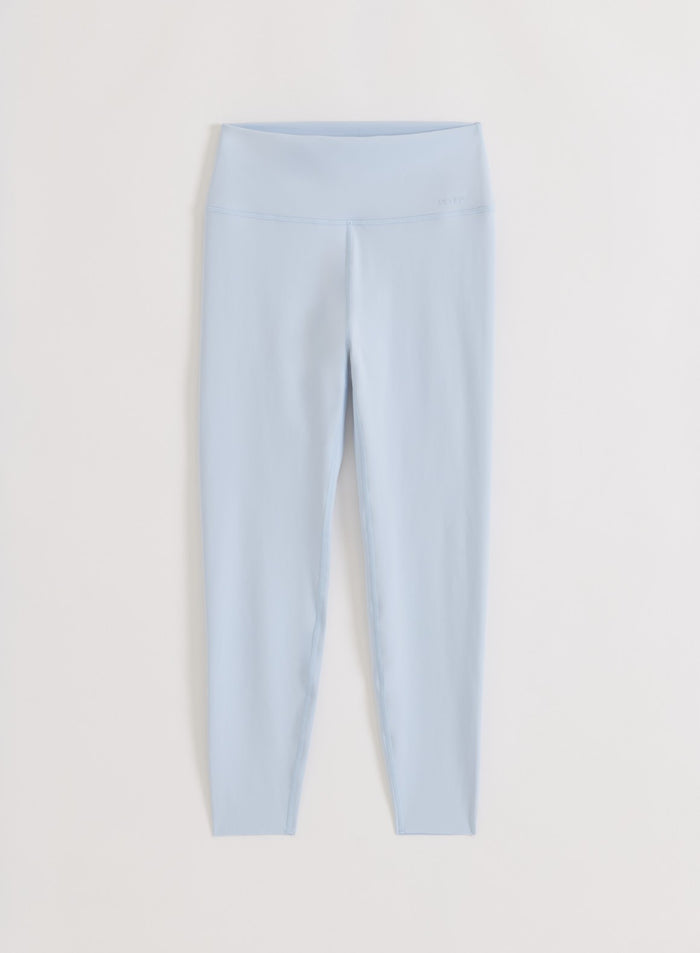 Lyseblå Aura Sense Tights fra aim'n med høy midje i mykt, squat proof-materiale, vist som flatlay.