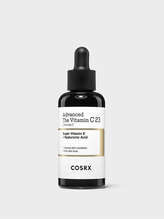 COSRX Advanced The Vitamin C 23 Serum bottle featuring Super Vitamin E and Hyaluronic Acid; high-potency 23% stabilized Vitamin C formulation designed to brighten dull skin, refine pores, and even skin tone while hydrating; minimal modern K-beauty packaging emphasizing clinical-grade clarity and gentle brightening care.